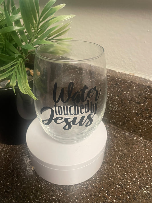 Water touched by Jesus wine glass